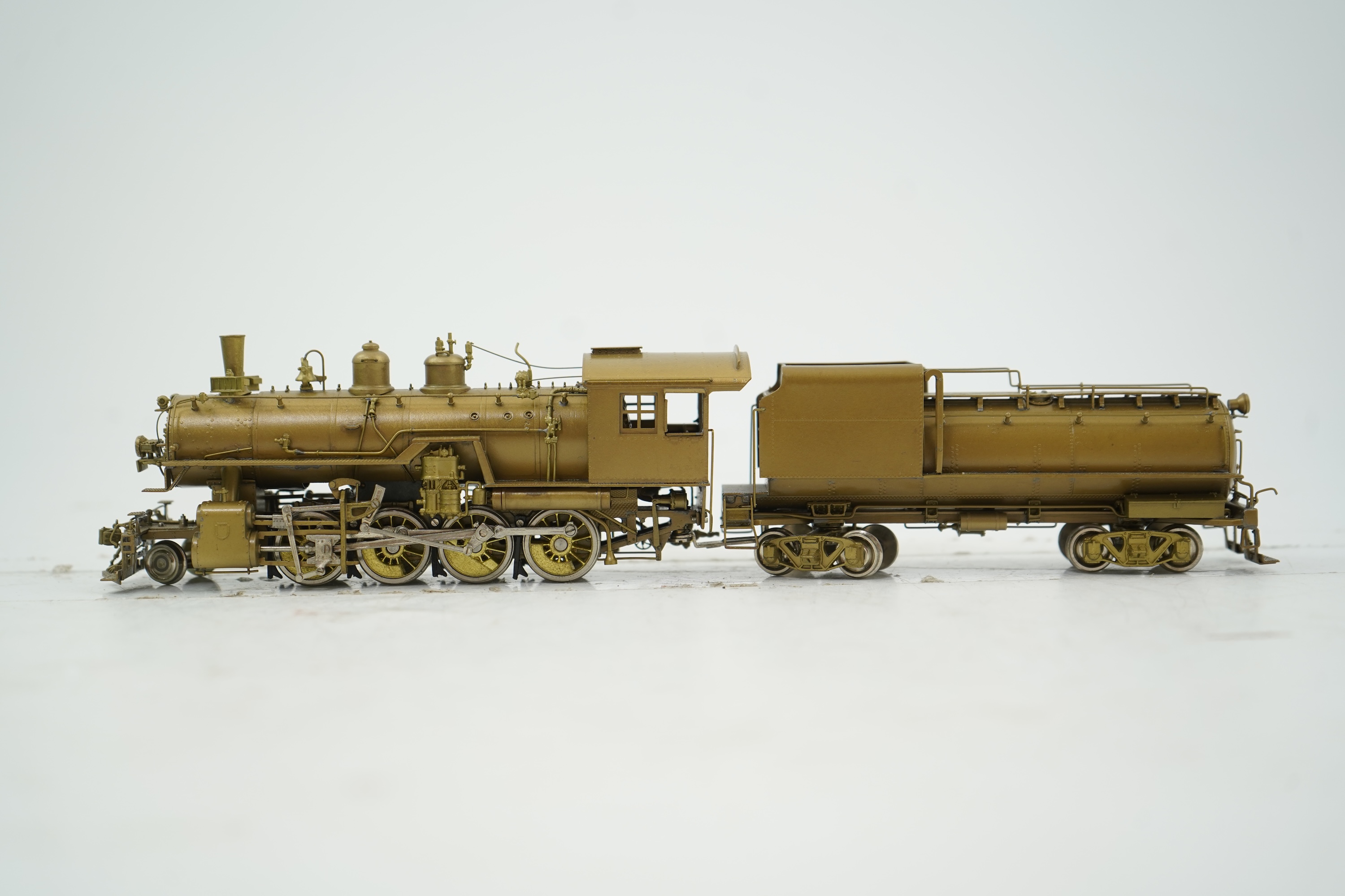 A boxed HO gauge Overland Models Inc. J.P.M. unpainted brass model of Union Pacific Railway C-57, 2-8-0 locomotive with bogie tender, powered for two rail operation.